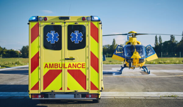 Emergency Medical Service Ambulance car against helicopter of emergency medical service. Themes rescue, help and hope.